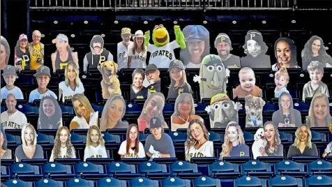  ?? Matt Freed/Post-Gazette ?? Fan cutouts occupy a section of seats Wednesday during a Pirates game at PNC Park.