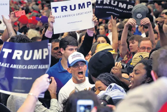  ?? GERALD HERBERT/AP ?? A Donald Trump supporter shouting at protesters who were chanting ‘black lives matter’ during a campaign rally for the Republican businessma­n in New Orleans last week