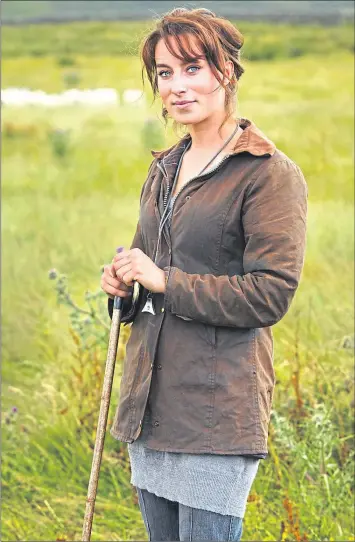  ??  ?? Shepherd Emma Gray with her sheep National Trust Images/ Arnhel de Serra