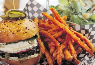  ?? ALLEN McINNIS FILES ?? La Boulette’s excellent burgers have included a chèvre burger with sweet potato fries and caesar salad. Friendly, efficient service tops off the great experience.