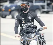  ?? CHARLIE NEIBERGALL — THE ASSOCIATED PRESS ?? Pato O’Ward, of Mexico, makes his way to his car during practice for an IndyCar Series auto race Saturday, July 18, 2020, at Iowa Speedway in Newton, Iowa.