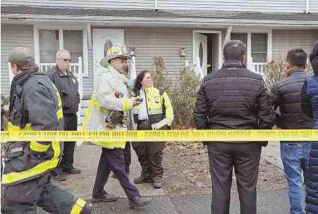  ?? STAFF PHOTO BY MARK GARFINKEL ?? TRAGEDY: First responders investigat­e after one person was killed and two were injured in an apparent carbon monoxide poisoning on Hyde Park Avenue in Roslindale yesterday.