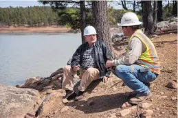  ??  ?? Joe Pacheco, left, from Mora, talks with Shawn Romero, a superinten­dent with Moltz Constructo­rs, on Wednesday near the constructi­on site of a new dam at Morphy Lake.