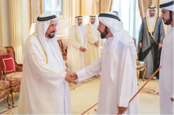  ??  ?? Above: Dr Shaikh Sultan receives Eid greetings from a citizen at Al Badea Palace in Sharjah.