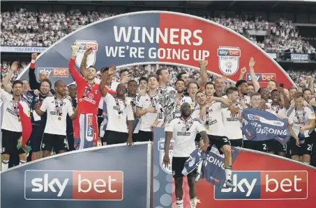  ??  ?? Fulham players celebrate after beating Aston Villa at Wembley.