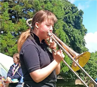  ?? ?? Clockwise from top left: Lizzie Perryman (16) from Bath playing the trombone in 2022; Lizzie and Aiden Johnson from the Midsomer Norton Silver Band; Lizzie in 2012; A subsection of the Midsomer Norton Silver Band rehearsing at Radstock Trinity Methodist Church