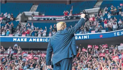  ?? EVAN VUCCI THE ASSOCIATED PRESS ?? U.S. President Donald Trump arrives onstage to speak at a campaign rally at the BOK Center on Saturday in Tulsa, Okla.