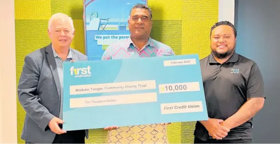  ?? Photo / Supplied ?? Waikato Tongan Community Charity Trust chairman Mefi Naufahu receives FCU'S $10,000 donation from board member and HCC councillor Rob Pascoe and FCU staff member Ben Tonga. The trust will use the funds to support a broader community response in Tonga