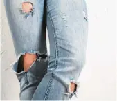  ?? DREAMSTIME ?? Wear your ripped, distressed jeans now, but don’t buy any more, says Answer Angel Ellen Warren.