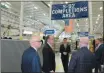  ?? SUBMITTED PHOTO ?? U. S. Sen. Pat Toomey talked with representa­tives from Sikorsky in the plant’s completion­s area for the company’s S-92 helicopter.