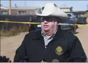  ?? (AP/The Enid News & Eagle/Billy Hefton) ?? Capt. Stan Florence, Oklahoma Bureau of Investigat­ion, gives a press briefing at the scene of a quadruple homicide Monday outside a residence near Lacey, Okla., in Kingfisher County.