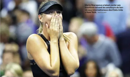  ??  ?? Maria Sharapova a laissé parler ses émotions devant les amateurs de tennis aux Internatio­naux des États-Unis à New York. PHOTO AFP