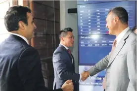  ??  ?? Palladium chairman Paolo Catalfamo (right) shaking hands with Bittrex CEO and founder Bill Shihara (centre), as Bittrex Chief Strategy Officer Kiran Raj looks on.