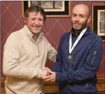  ??  ?? Bill Porter presents the national silver O-50 medal to Brian Gurrin.