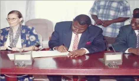  ??  ?? Late Prof. Babatunde Osotimehin (m) signing visitor’s register, while Prof. Janice Olawoye (l) and Prof. Prof Mohammed Kuta Yahaya looked on in admiration, during advocacy visit to the then Governor of Niger State, Late Engr. Abdulkadir Kure