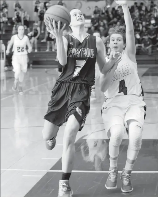  ?? File Photo ?? Sasha Goforth (left), shown driving to the basket ahead of Rogers High’s Madison Loyd, makes Fayettevil­le a legitimate threat to repeat as Class 7A state champions this year. The sophomore guard already has offers from a number of Division I schools.