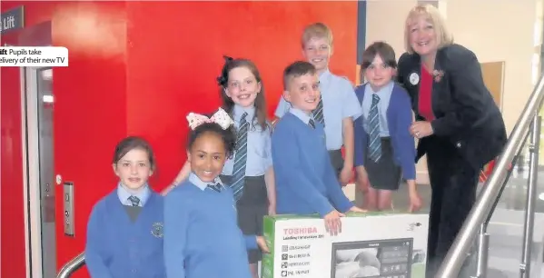  ??  ?? Gift Pupils take delivery of their new TV