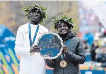  ?? SARAH STIER GETTY IMAGES ?? Kenya’s Geoffrey Kamworor and Joyciline Jepkosgei won the men’s and women’s divisions of the New York City Marathon.