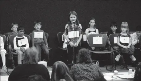  ?? Herald photo by Greg Bobinec ?? Aziana Perkins takes a shot at spelling words in the Lethbridge Public Library spelling mini-bee for Grades 1 through 3 Saturday afternoon.