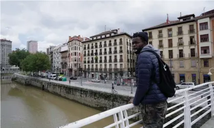  ?? Photograph: Vincent West/Reuters ?? ‘It came from my heart’: Mouhammad Diouf, 26, on a bridge over the river Nervión, in Bilbao, where he rescued a drowning man.