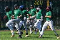  ?? KARL MONDON — BAY AREA NEWS GROUP ?? Prospectiv­e players loosen up at the Oakland Ballers tryout Saturday at Laney College. The Pioneer League team's season opener is May 21.