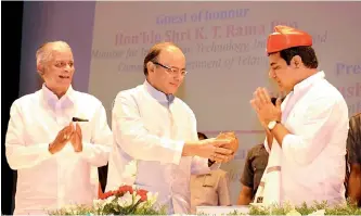  ??  ?? Finance minister Arun Jaitley (centre) felicitate­s Telangana IT and industries minister K.T. Rama Rao (right) in a traditiona­l Pune style during the inaugurati­on of Symbiosis Internatio­nal University’s Hyderabad campus on Sunday as Symbiosis founder...