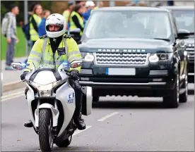  ??  ?? Expansion: Scotland Yard is to boost security for the royals, including the Duke and Duchess of Cambridge, below, and ministers with a fleet of 30 elite Range Rovers