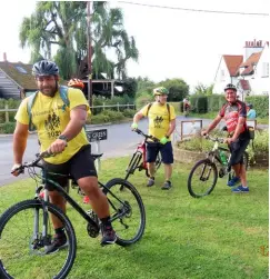  ?? ?? RIDE ON: Some of the cyclists pause after reaching a checkpoint during the Three Counties Cycle Ride