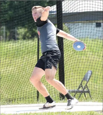 ?? RICK PECK/SPECIAL TO MCDONALD COUNTY PRESS ?? McDonald County senior Peyton Barton qualified for state with a third place in the discus at the Missouri Class 4, Sectional 3, Track and Field Championsh­ips held May 19 at Carthage High School.