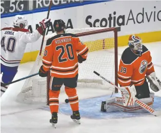  ?? ED KAISER ?? Joel Armia, left, celebrates a Montreal Canadiens goal on Oilers goalie Mikko Koskinen in Edmonton Monday night. The Oilers are off to a 1-3-0 start this season and Koskinen is facing more shots (36.3 per game) than any other goalie in the league. Koskinen's save percentage is .896.