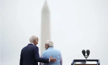  ?? Associated Press ?? President Joe Biden speaks with India’s Prime Minister Narendra Modi during a state arrival ceremony on the South Lawn of the White House in Washington on Thursday.
