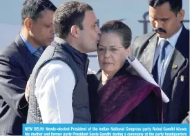  ??  ?? NEW DELHI: Newly-elected President of the Indian National Congress party Rahul Gandhi kisses his mother and former party President Sonia Gandhi during a ceremony at the party headquarte­rs in New Delhi yesterday. —AFP