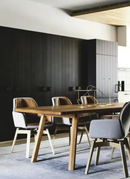  ??  ?? In the dining room, custom cherrywood dining table by JOHN WATERS; MOBITEC dining chairs from Temperatur­e Design; Objects of Free Use table accessorie­s by ANNA VARENDORFF from Hub Furniture; SAHAR COLLECTION Fresco rug from Behruz Studio.