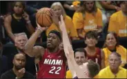  ?? ?? Miami Heat forward Jimmy Butler (22) shoots Thursday during the first half of Game 1 of the NBA Finals in Denver. Butler scored 13 points in a 104-93 loss to the Denver Nuggets. (AP/David Zalubowski)