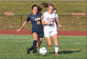  ?? AUSTIN HERTZOG - MEDIANEWS GROUP ?? Pope John Paul II’s Julia Hull (11) and Pottsgrove’s Hailey Strain (13) compete for the ball in the second half Tuesday.