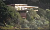  ??  ?? A bluff-top house, apparently owned by rock crooner Chris Isaak, sits abandoned above Tunitas Creek Beach.