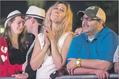  ?? CP PHOTO ?? Fans are emotional while attending a public viewing of the The Tragically Hip’s final concert of the “Man Machine Poem” tour in Halifax on Saturday.