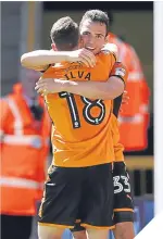  ??  ?? Wolves players Diogo Jota and Leo Bonatini celebrate together.