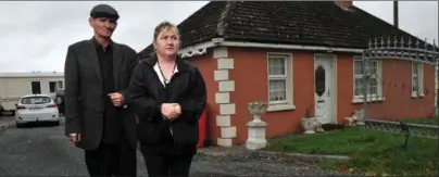  ??  ?? Helen and Thomas O’Driscoll - pictured soon after the tragic deaths of their boys in 2014 - outside the house which Cork County Council are now to demolish