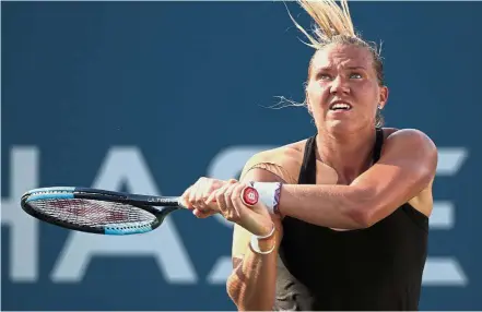  ??  ?? — AP Tough cookie: Kaia Kanepi of Estonia returning a shot to Darya Kasatkina of Russia in the fourth round on Monday.