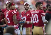  ?? KARL MONDON — BAY AREA NEWS GROUP FILE ?? San Francisco 49ers quarterbac­k Trey Lance (5) talks on the sidelines with fellow quarterbac­ks Josh Rosen (3) and Jimmy Garrapolo after throwing an 80-yard touchdown pass in the first quarter Saturday, Aug. 14, in a preseason game against the Kansas City Chiefs at Levi’s Stadium in Santa Clara.