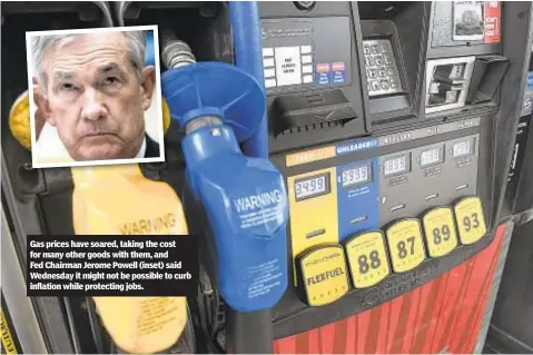  ?? ?? Gas prices have soared, taking the cost for many other goods with them, and Fed Chairman Jerome Powell (inset) said Wednesday it might not be possible to curb inflation while protecting jobs.