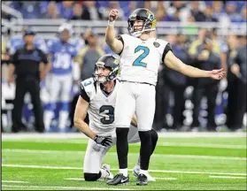  ?? JEFF HAYNES / ASSOCIATED PRESS ?? Jacksonvil­le kicker Jason Myers and holder Brad Nortman watch a missed conversion try in a recent game against Detroit. Only eight kickers are perfect on 2016 extra points.