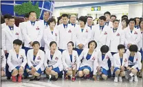  ??  ?? Members of North Korea’s delegation for the 2016 Rio de Janeiro Olympic Games prepare to pose for a group photo before leaving
Pyongyang Internatio­nal Airport to Brazil on July 26. (AFP)