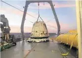  ?? AP FILE ?? SpaceX hopes its Dragon capsule, above, will carry two people to the moon next year on a private flight.