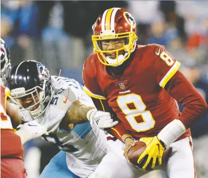  ?? MARK ZALESKI/THE ASSOCIATED PRESS ?? Former NFL quarterbac­k Josh Johnson, with ball while playing for the Washington Redskins in 2018, is one of the most recognizab­le players in the new XFL. Johnson will suit up for the Los Angeles Wildcats, one of eight teams in the newly formed league