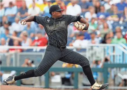  ?? BRUCE THORSON/USA TODAY SPORTS ?? Vanderbilt starter Kumar Rocker pitches against Michigan during the second game of the 2019 College World Series championsh­ip series at TD Ameritrade Park.