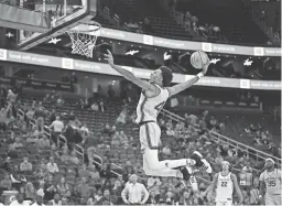  ?? AP ?? Arizona State guard Desmond Cambridge Jr. soars for a dunk against USC in a Pac-12 tournament quarterfin­al on Thursday in Las Vegas.