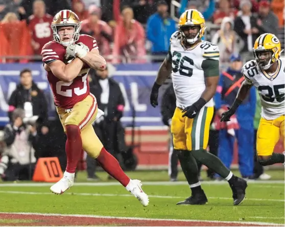  ?? GODOFREDO A. VÁSQUEZ/AP ?? Running back Christian McCaffrey scores on a six-yard touchdown run to give the 49ers the lead with 1:07 remaining in the fourth quarter.