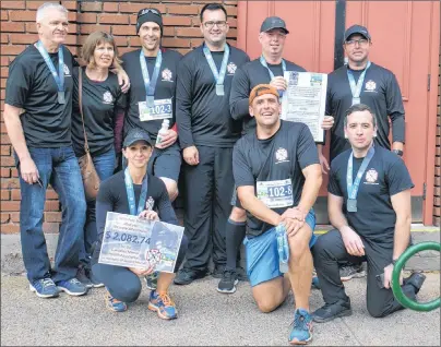  ?? KATIE SMITH/THE GUARDIAN ?? Members of the Cross Roads Fire Department in Stratford, who participat­ed in the corporate relay of the P.E.I. Marathon, ran for the son of one of their fellow firefighte­rs who took his life earlier this year. This year, the marathon is in support of...